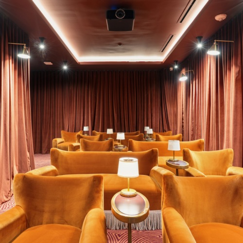Orange chairs in screening room at Stella at Star Metals in West Midtown Atlanta