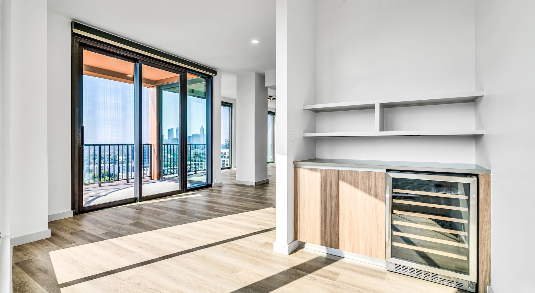 room with large windows and wine fridge