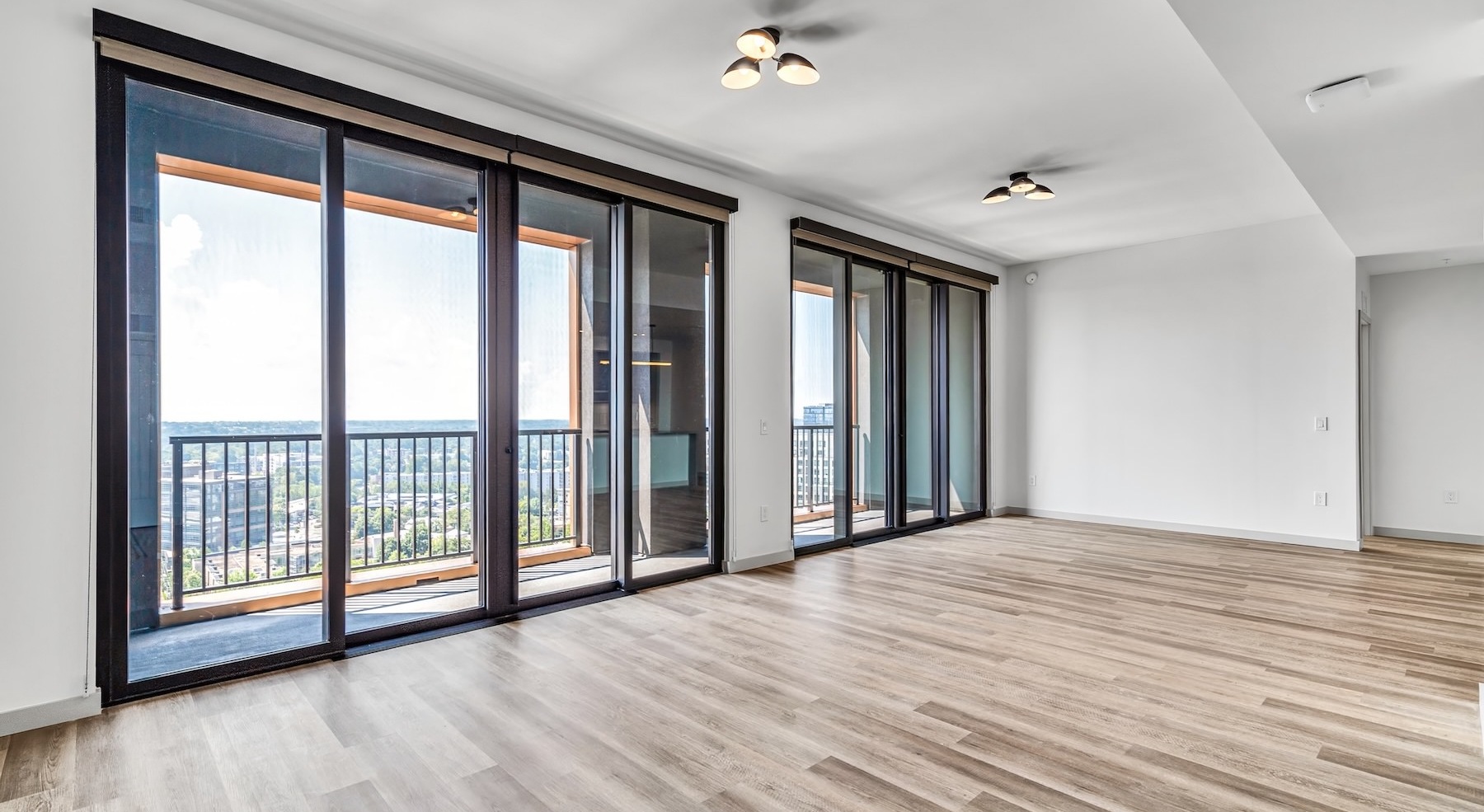 unfurnished living room with large windows