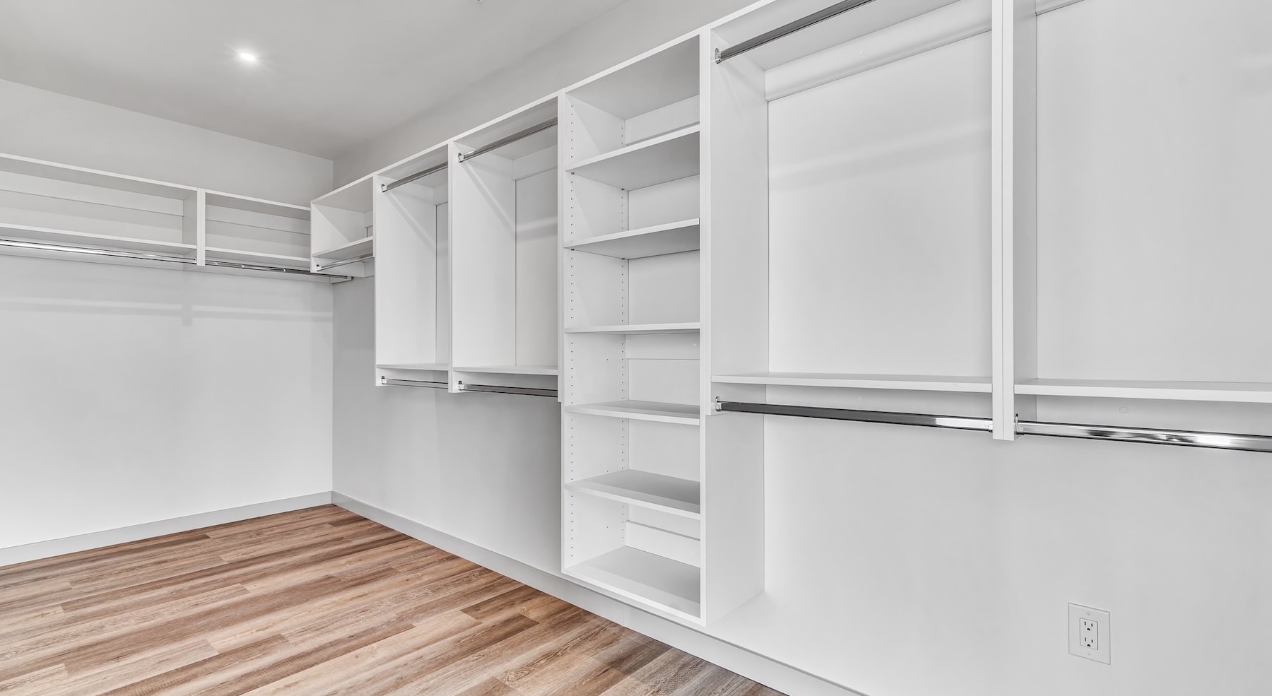 large walk-in closet with shelves