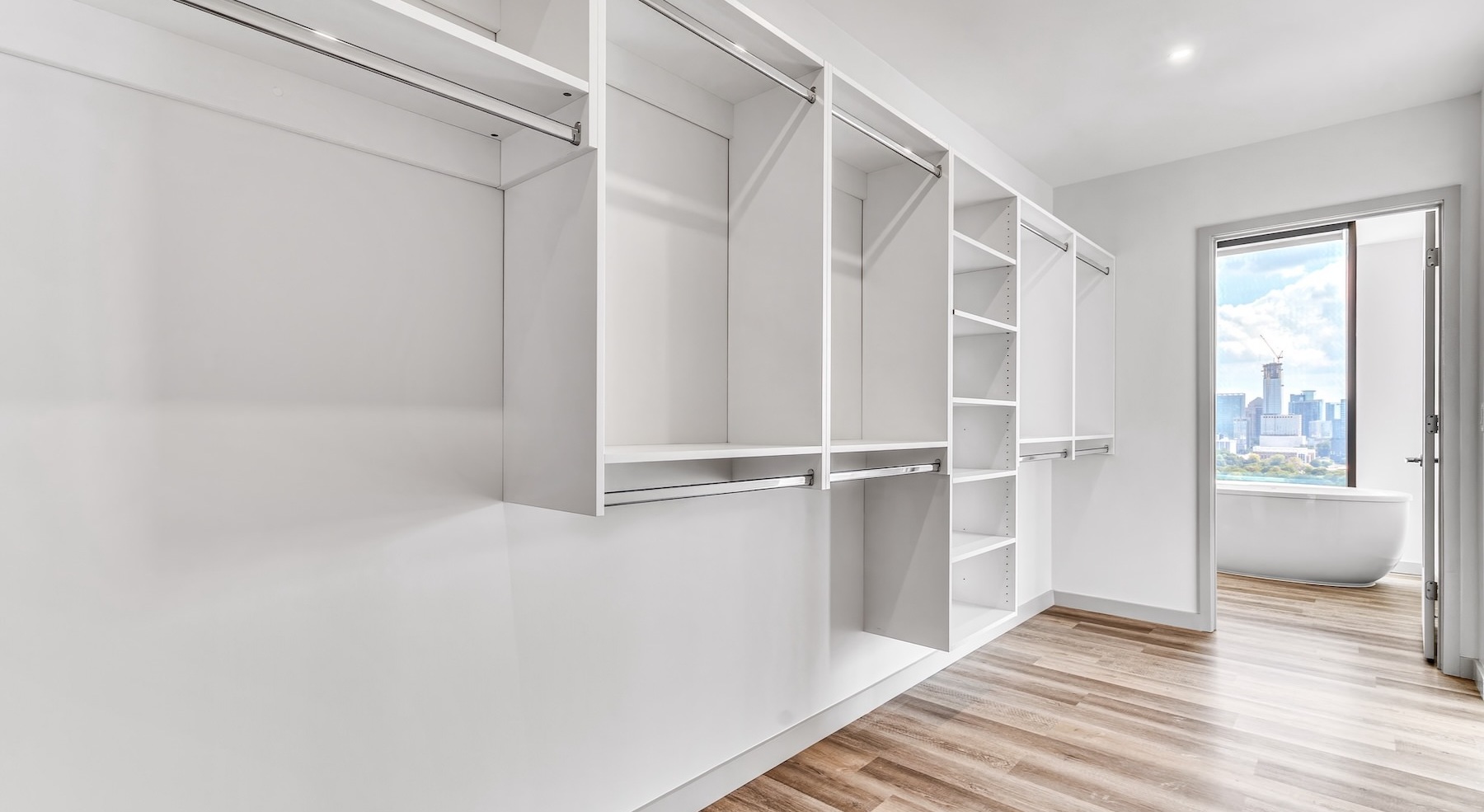 large walk-in closet with shelves