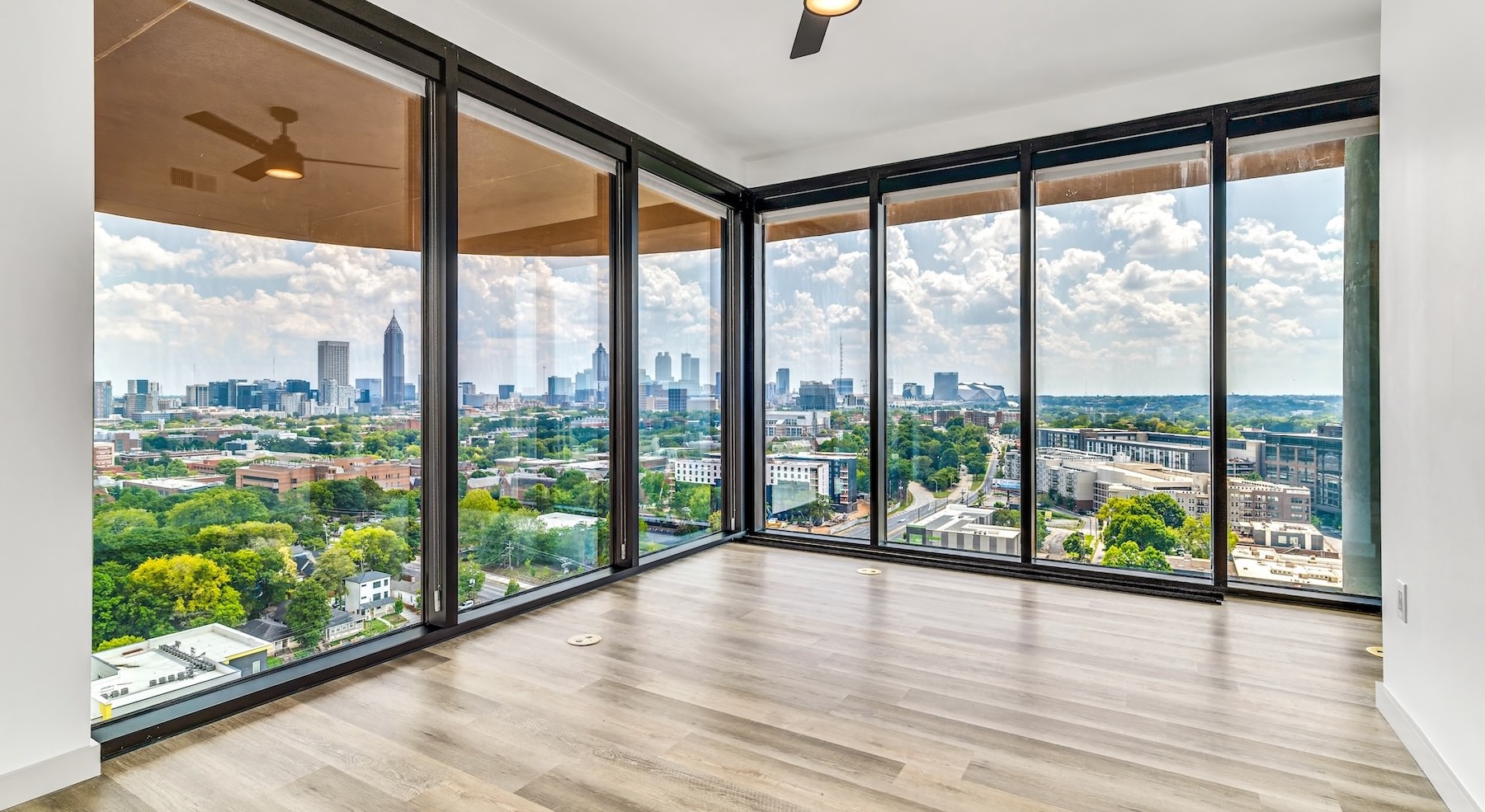 unfurnished room with large windows